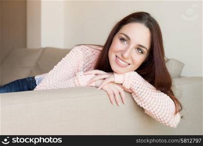 Portrait of a pretty woman relaxing on couch
