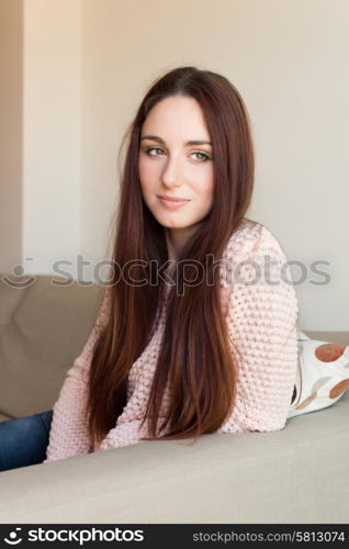 Portrait of a pretty woman relaxing on couch