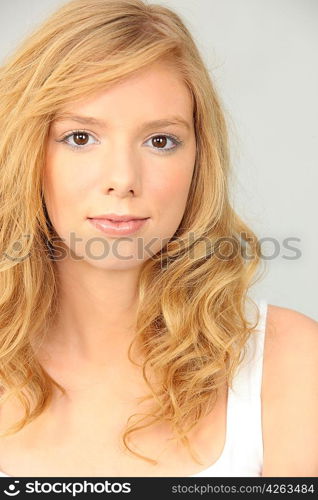 Portrait of a pretty young woman in a vest