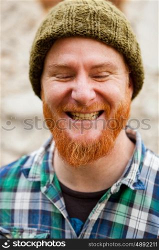 Portrait of a red haired man in a rural enviroment