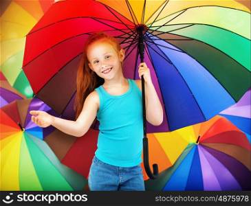 Portrait of a redhead child with an umbrella
