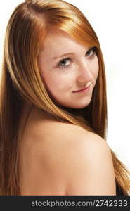 portrait of a redhead girl looking over her shoulder. portrait of a redhead girl looking over her shoulder on white background