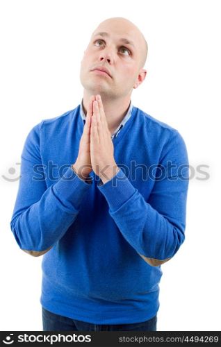 Portrait of a religious expressive man praying in studio on white isolated background