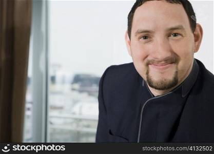 Portrait of a room service man smiling