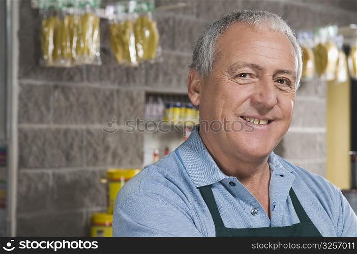 Portrait of a sales clerk smiling in a hardware store