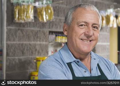 Portrait of a sales clerk smiling in a hardware store