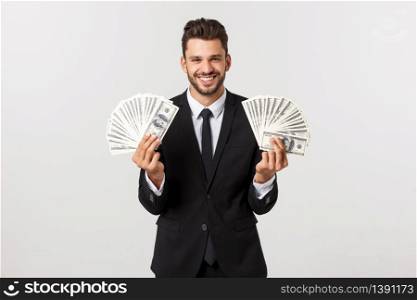 Portrait of a satisfied young businessman holding bunch of money banknotes isolated over white background. Portrait of a satisfied young businessman holding bunch of money banknotes isolated over white background.