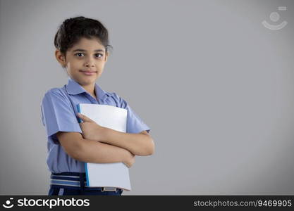 portrait of a school girl holding a book