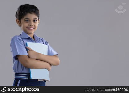 portrait of a school girl holding a book