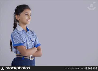 portrait of a school girl smiling at something