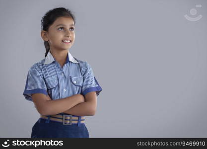 portrait of a school girl smiling at something