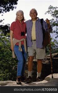 Portrait of a senior couple standing on a rock