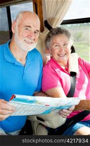 Portrait of a senior couple traveling together in their motor home.