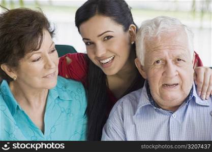 Portrait of a senior couple with their granddaughter
