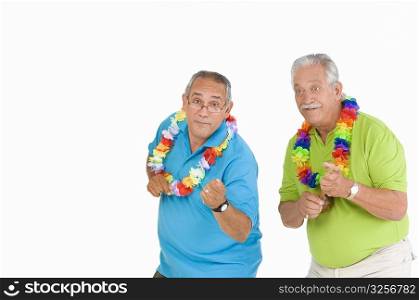 Portrait of a senior man and a mature man dancing