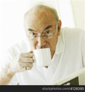 Portrait of a senior man drinking coffee