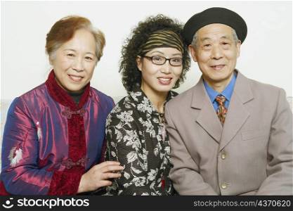 Portrait of a senior man sitting with two mature women