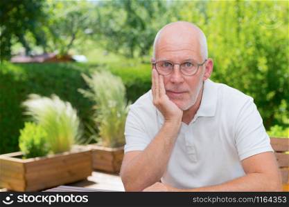 Portrait of a senior man smiling in the garden