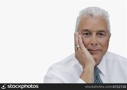 Portrait of a senior man thinking with his hand on his chin
