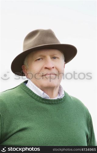 Portrait of a senior man wearing a hat