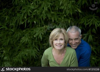 Portrait of a senior man with a mature woman smiling together