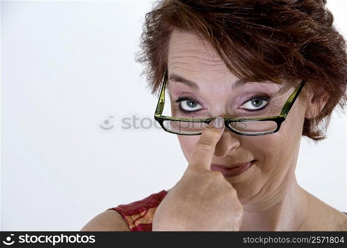 Portrait of a senior woman adjusting her eyeglasses