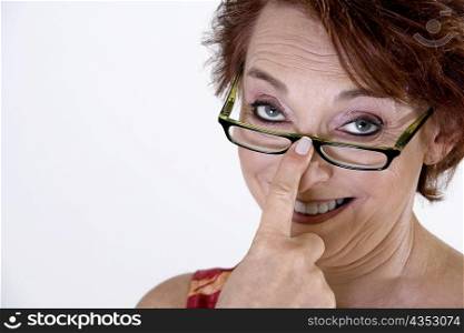 Portrait of a senior woman adjusting her eyeglasses