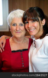 Portrait of a senior woman and a smiling young woman