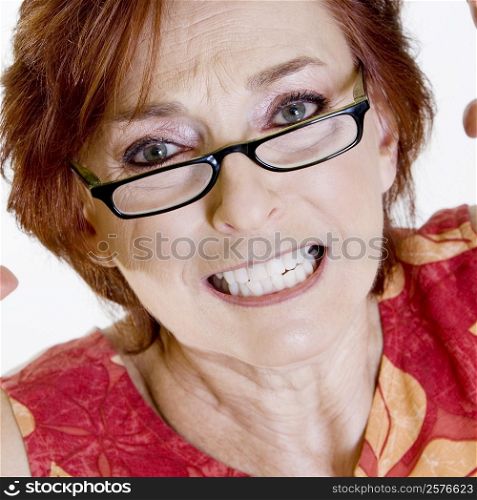 Portrait of a senior woman clenching her teeth