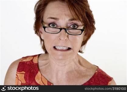 Portrait of a senior woman clenching her teeth