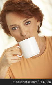 Portrait of a senior woman drinking a cup of coffee