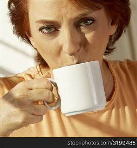 Portrait of a senior woman drinking a cup of coffee