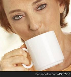 Portrait of a senior woman drinking a cup of coffee