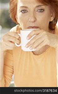 Portrait of a senior woman drinking coffee
