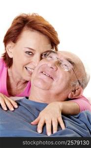 Portrait of a senior woman embracing a senior man from behind