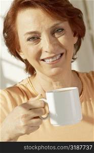 Portrait of a senior woman holding a coffee cup