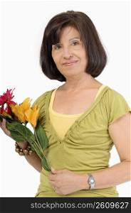 Portrait of a senior woman holding flowers