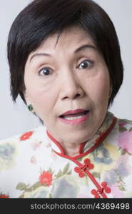 Portrait of a senior woman looking surprised