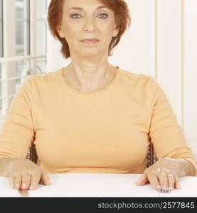 Portrait of a senior woman seated at the table