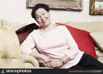 Portrait of a senior woman sitting on a couch