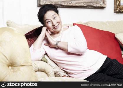 Portrait of a senior woman sitting on a couch