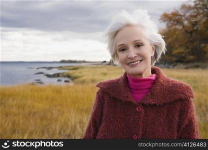 Portrait of a senior woman smiling on the beach