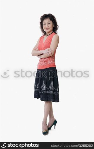 Portrait of a senior woman standing with her arms crossed