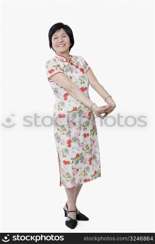 Portrait of a senior woman stretching her arms