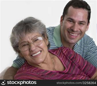 Portrait of a senior woman with her son smiling