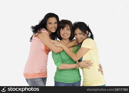 Portrait of a senior woman with her two daughters smiling