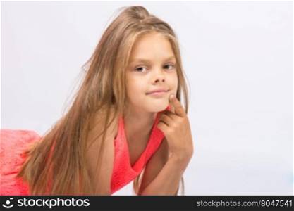 Portrait of a seven-year Conceived girl on a white background