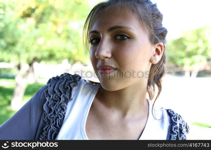 Portrait of a sexy young female in a park closeup