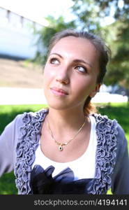 Portrait of a sexy young female in a park closeup