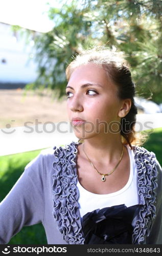 Portrait of a sexy young female in a park closeup